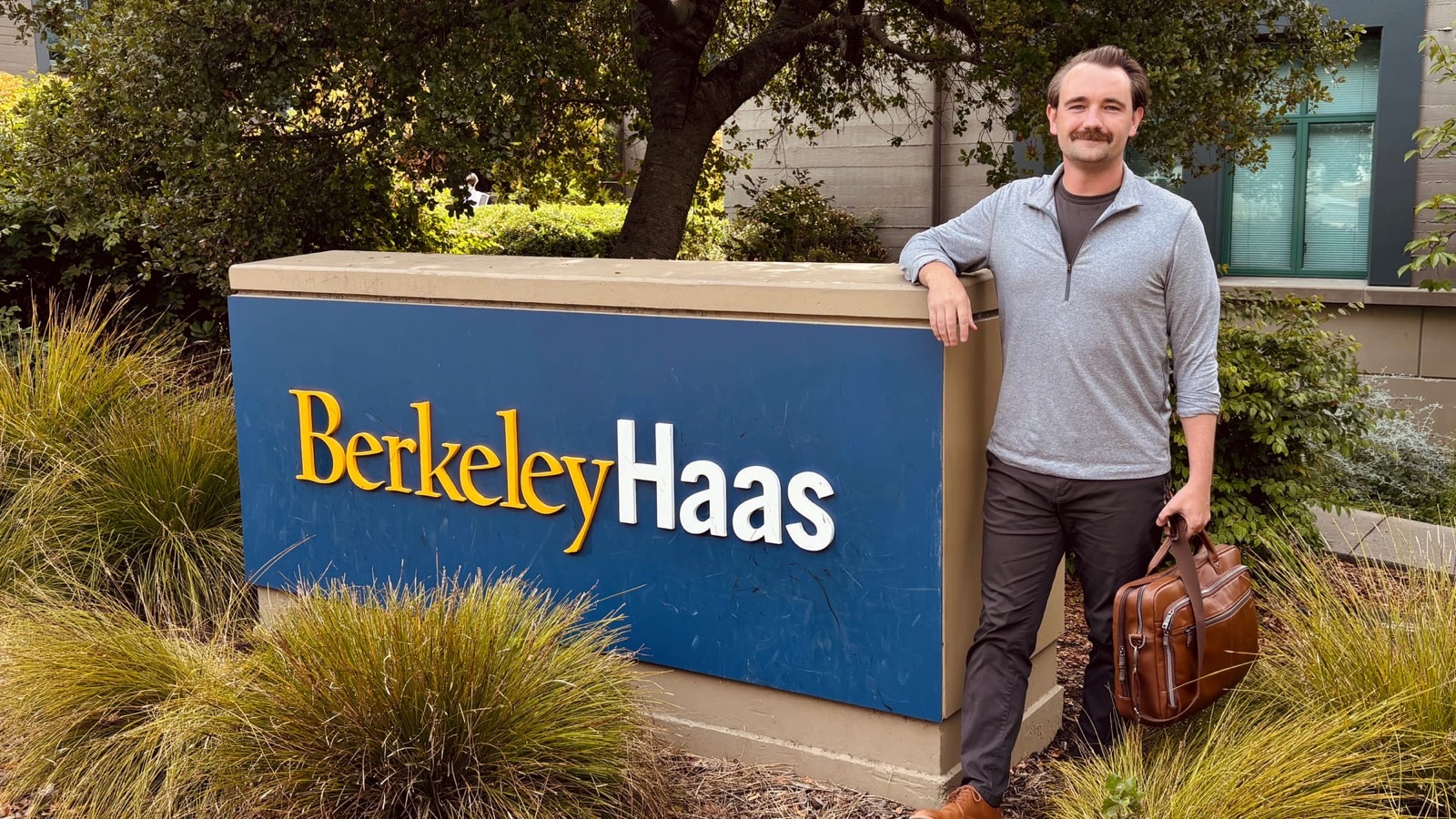 Drew Chapin beside the Berkeley Haas School of Business sign
